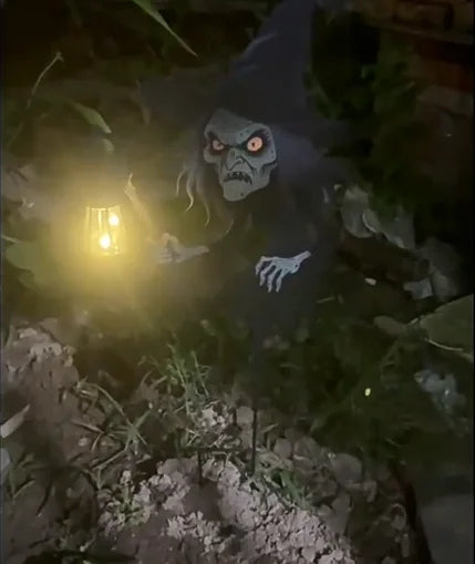 Wrought iron Halloween witch yard decoration with a glowing LED lamp