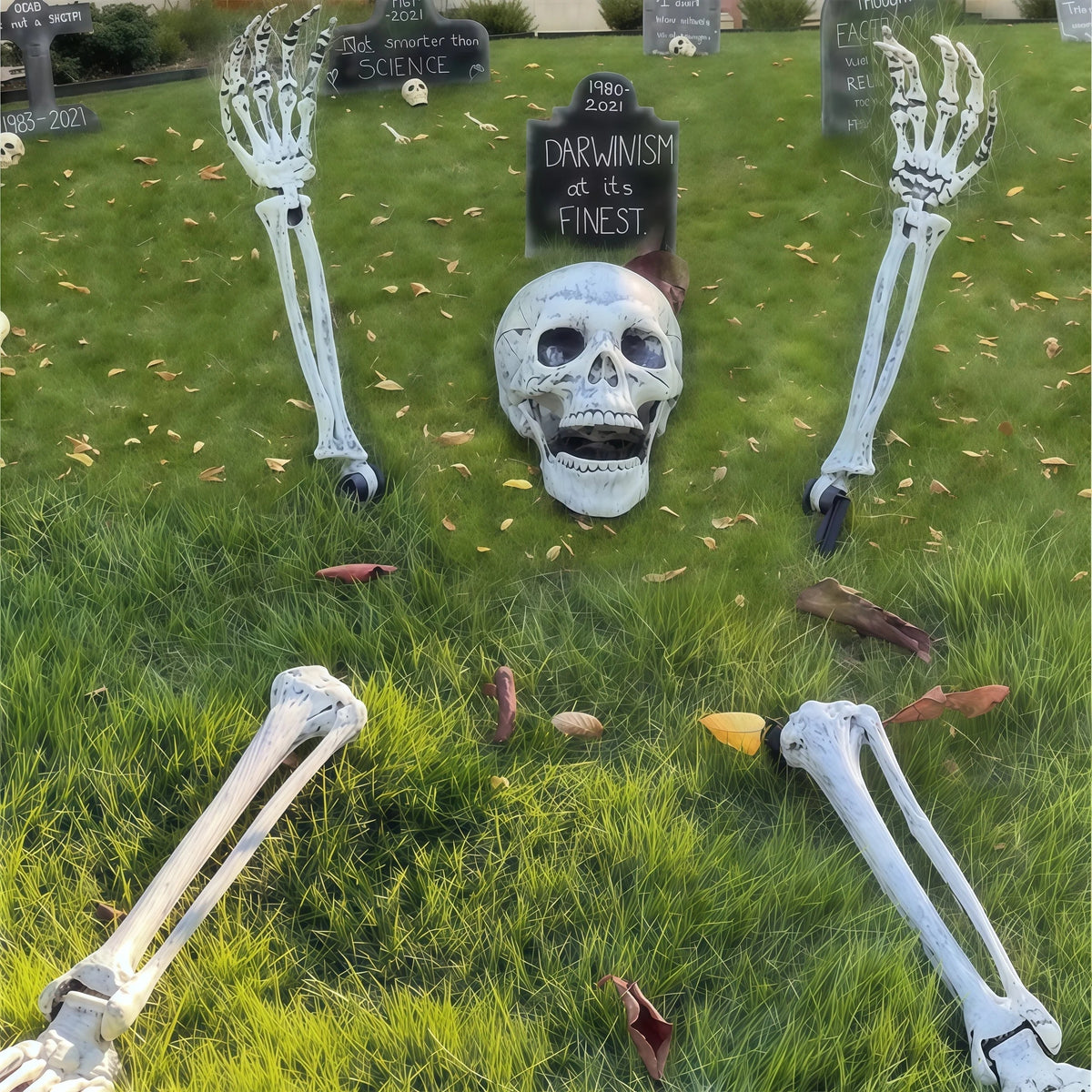 Halloween skeleton yard stakes with lifelike arms and legs in a lawn