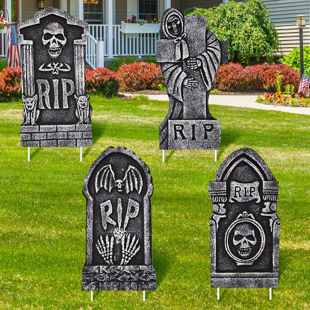 Set of four Halloween tombstone yard decorations with ground stakes