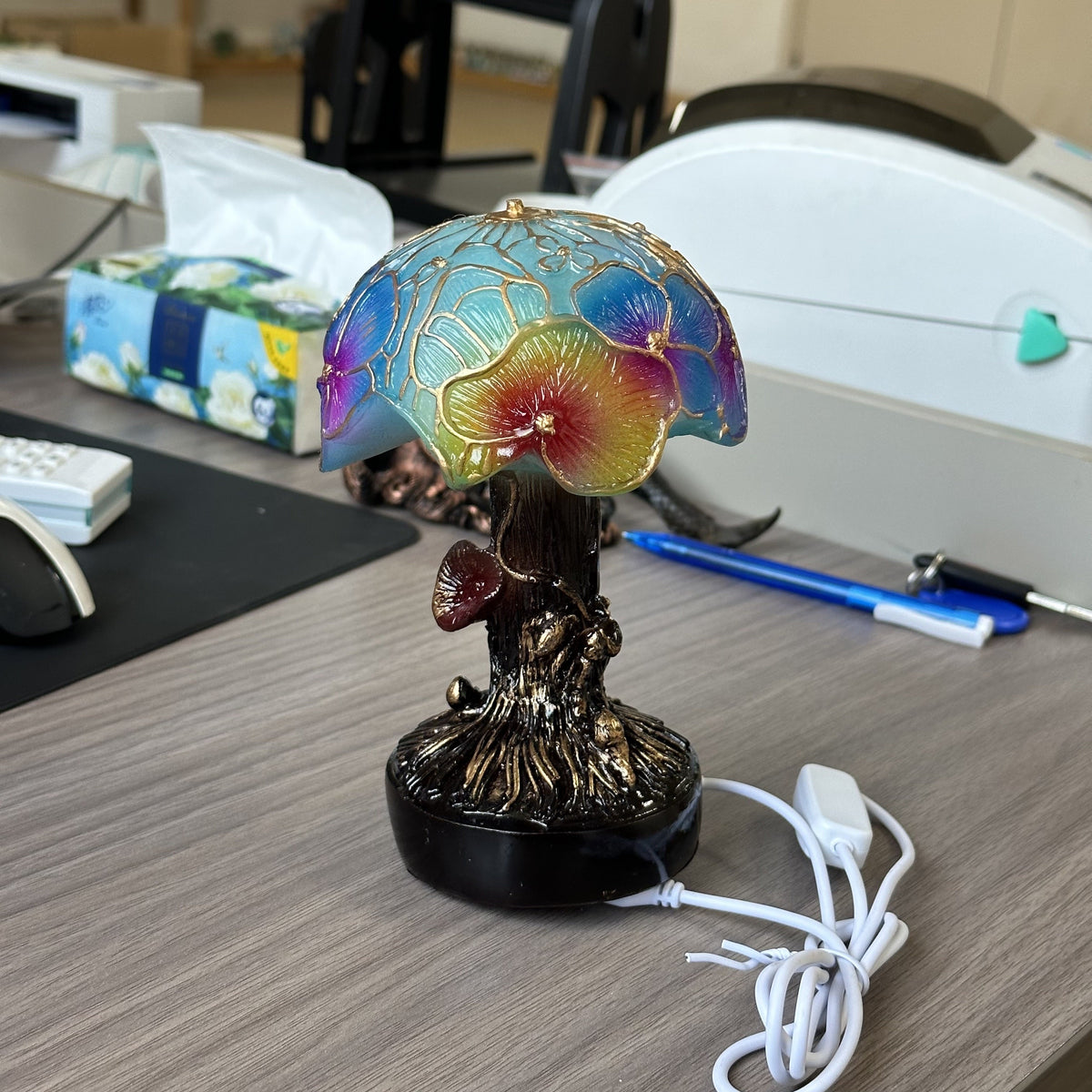 Mushroom night light shown on a desk surface