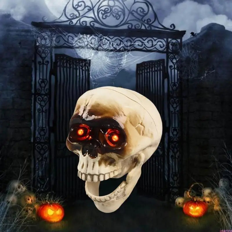 Animated skeleton head Halloween decoration with glowing red eyes