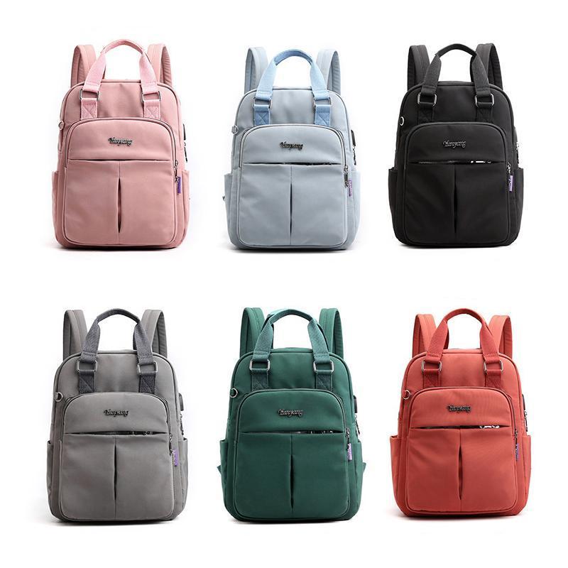 Travel Backpack in Water Resistant Oxford Fabric | Tablet Pocket, Phone Slot and Several Compartments | 28 by 36 by 12 cm