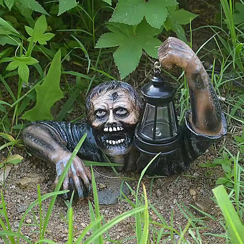 Lighted zombie lantern prop displayed along a garden path at night