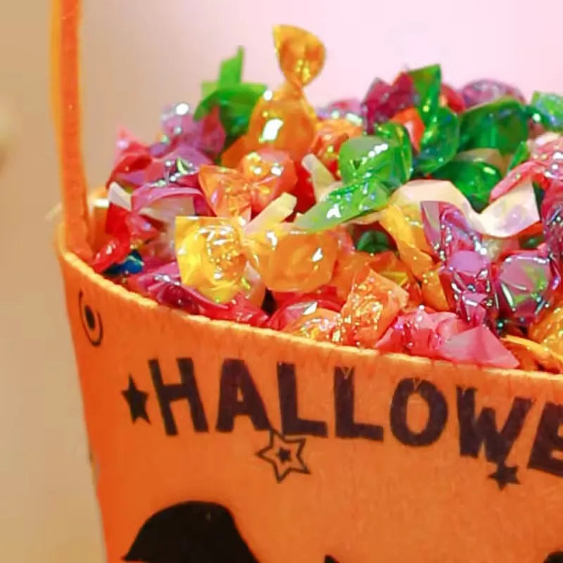 Halloween treat bucket filled with candy and small toys