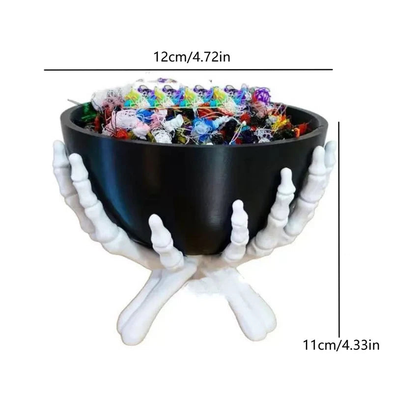 Skeleton hand bowl used as a Halloween party snack server on a table