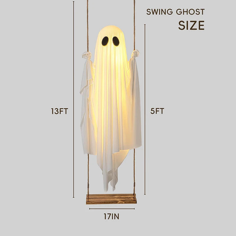 Tall Halloween ghost decoration hung from a tree branch outdoors