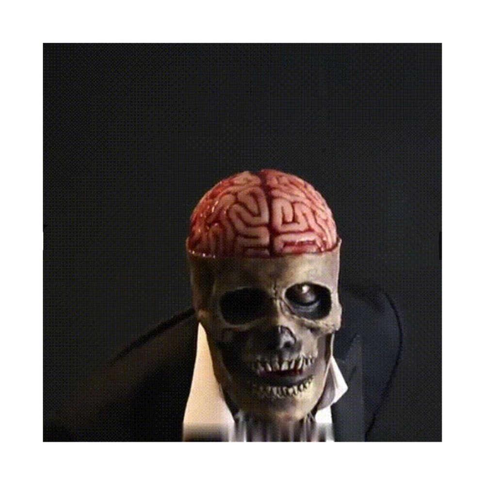Skull mask with moving jaw worn at a costume party