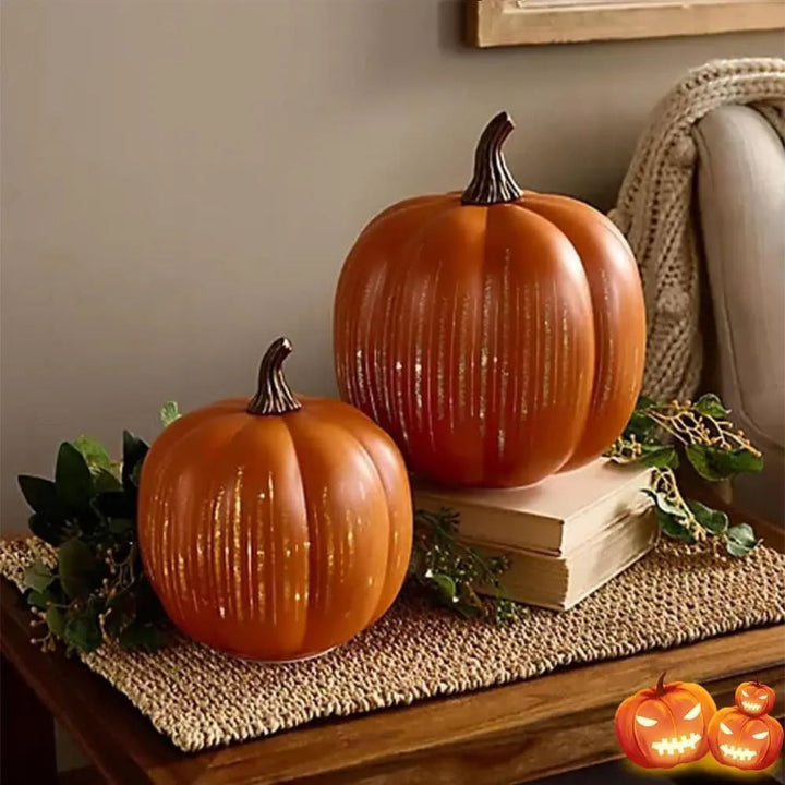 Small and large pumpkin lanterns displayed together