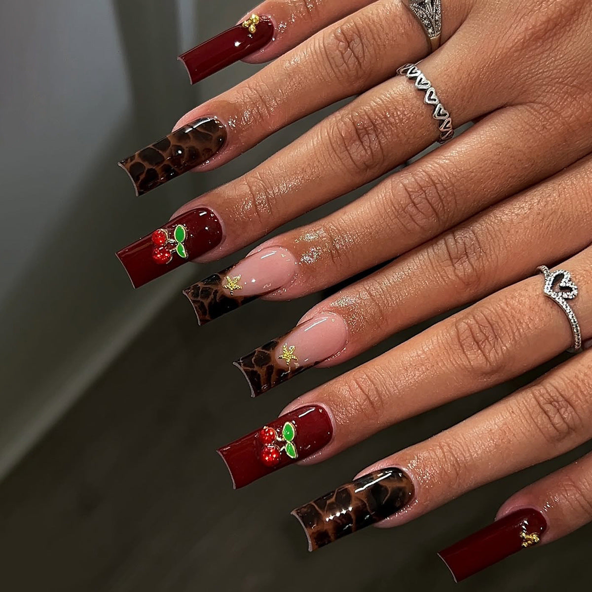 Leopard Print Christmas Nails with Red Berries | Gold Accent Press On Nail Designs | Festive Manicure for Winter Parties