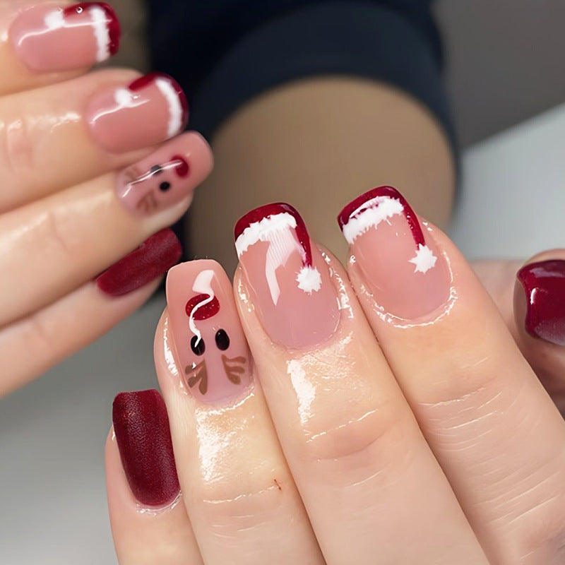 Reindeer and Santa Christmas Nails in Red and Pink | Snowflake Press On Nail Designs | Festive Winter Manicure