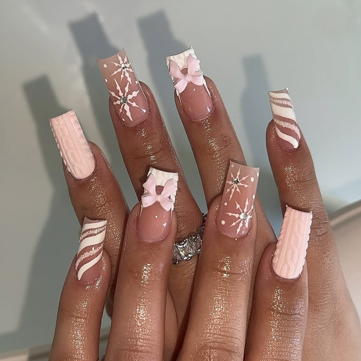 Snowflake Christmas Nails with Delicate Bow Details | Festive Press On Nail Designs | Easy Manicure for Winter Parties