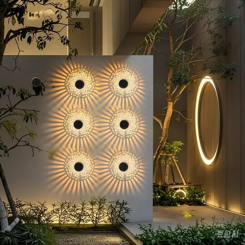 Hollow pattern solar wall lamp casting shadow patterns at night