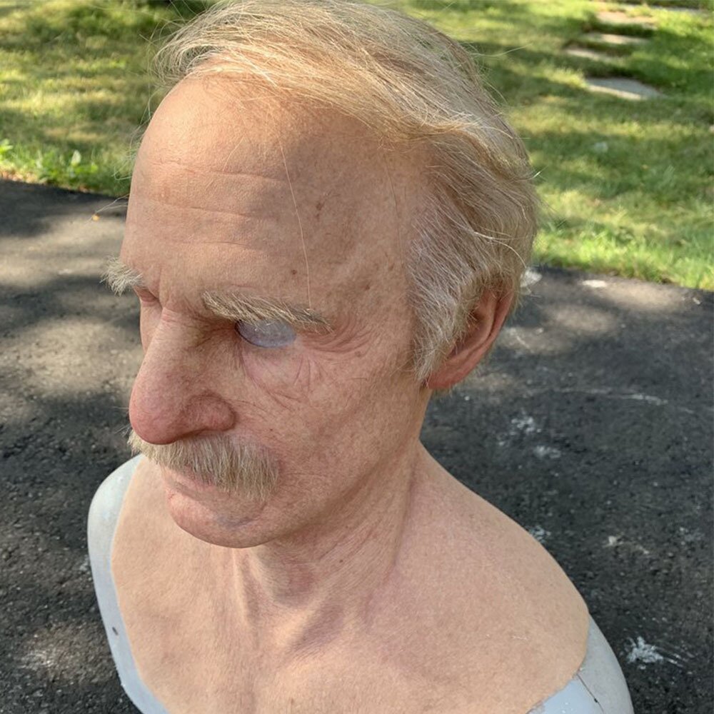 Close-up of the sculpted face detail on the old man latex mask