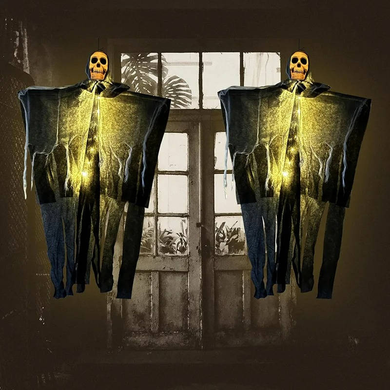 Pair of skull decorations hung in a doorway for Halloween