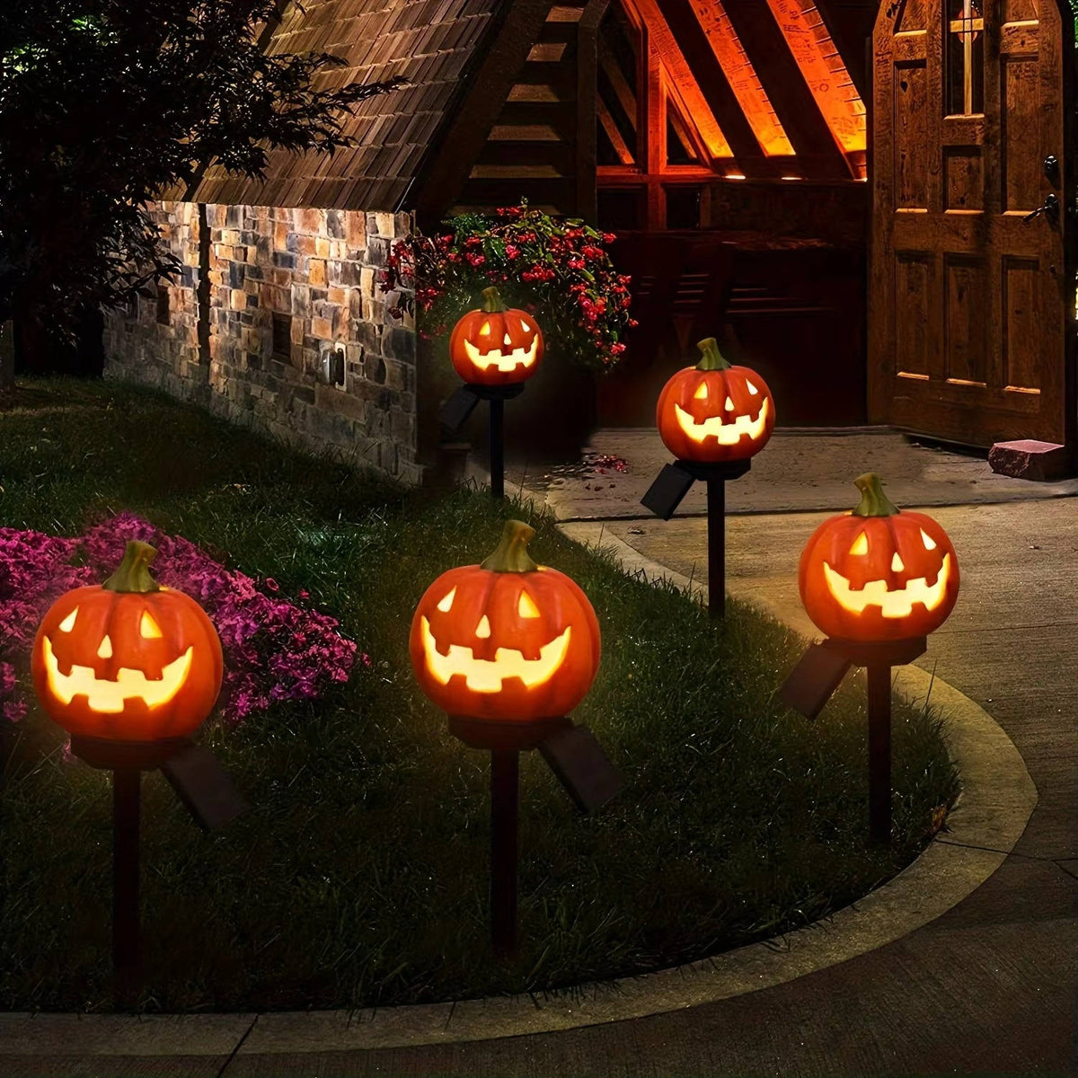 Pumpkin pathway lights shown in daylight as yard decor