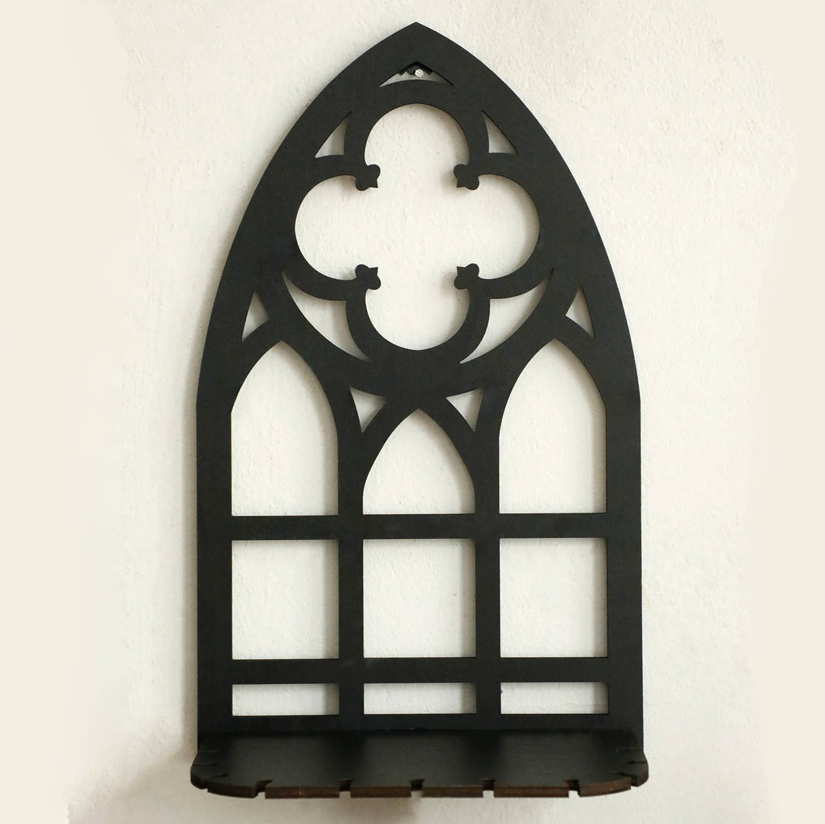 Three arch wall frames shown against a dark gothic wall