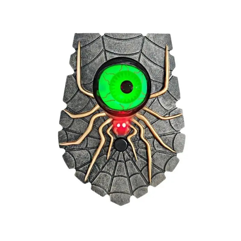 Green spider eye Halloween doorbell prop mounted beside a door
