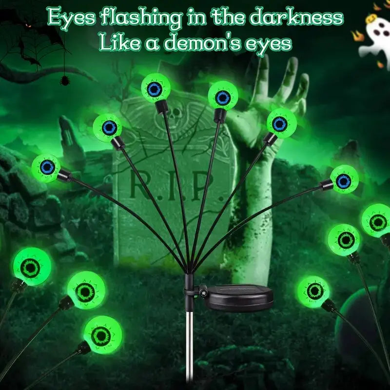 Solar Halloween eyeball garden lights glowing green along a pathway