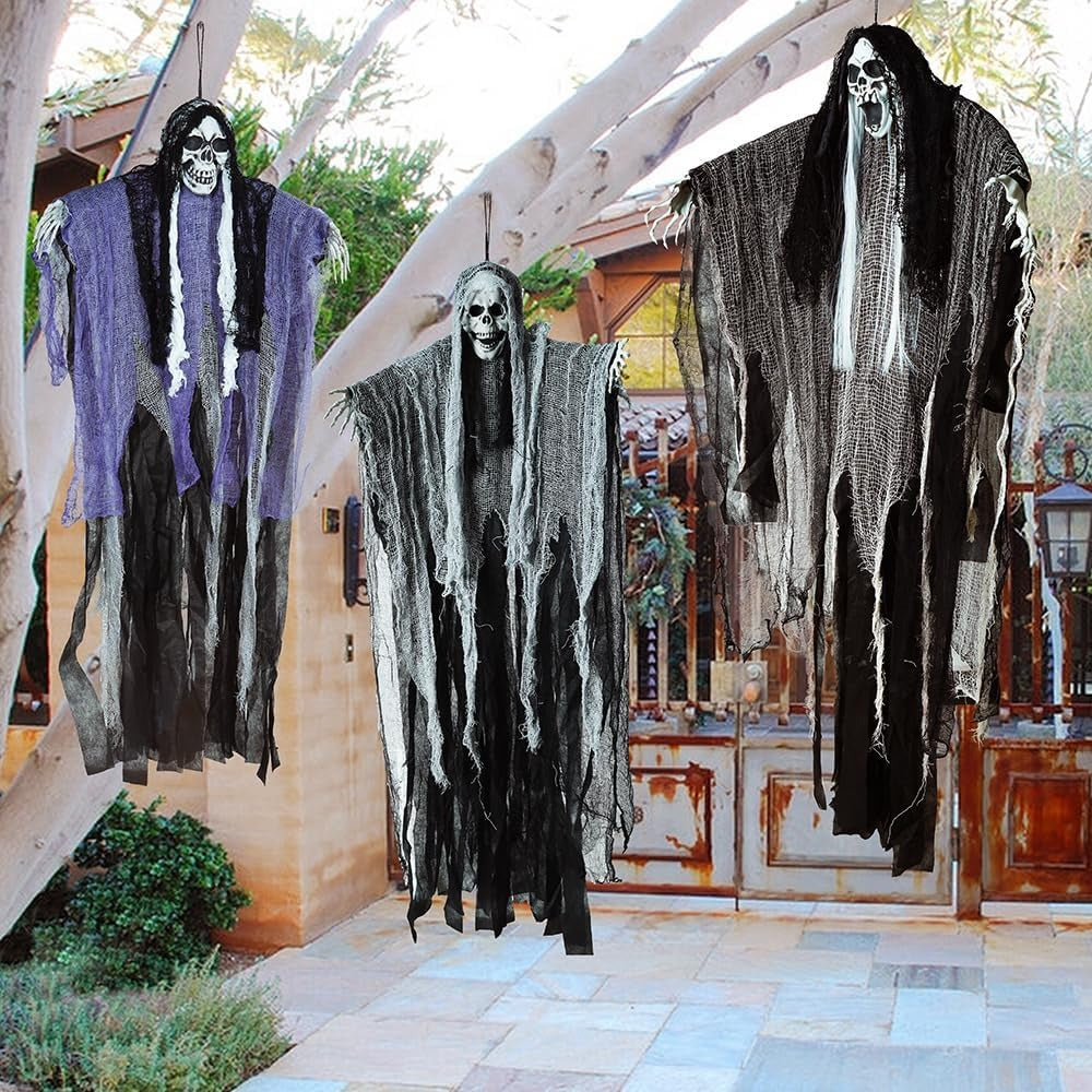Hanging reaper decorations suspended from a porch for Halloween