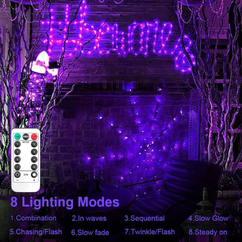 Halloween spider web lights glowing on an exterior wall