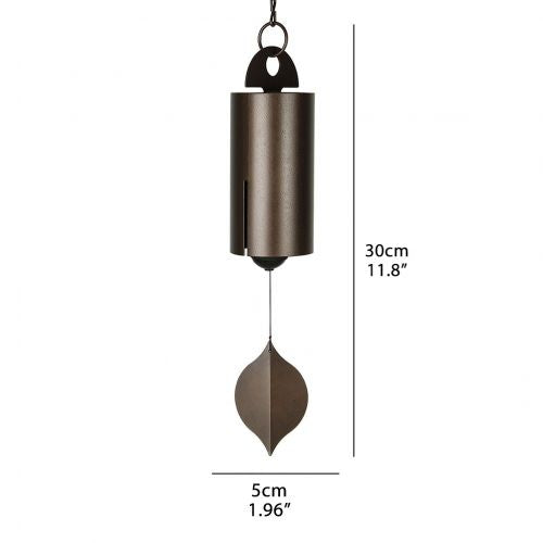 Wind chime hanging outdoors in a breezy garden setting