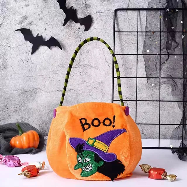 Orange pumpkin-shaped Halloween treat bag for kids with adjustable strap