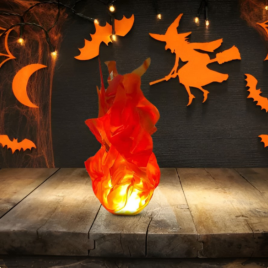 Glowing Halloween fireball prop lighting up a dark room