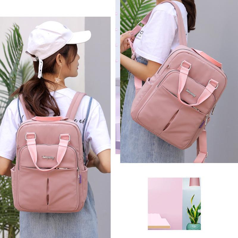Travel Backpack in Water Resistant Oxford Fabric | Tablet Pocket, Phone Slot and Several Compartments | 28 by 36 by 12 cm