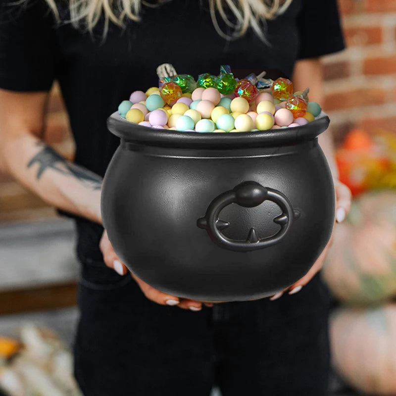 Witch cauldron Halloween candy bowl filled with treats