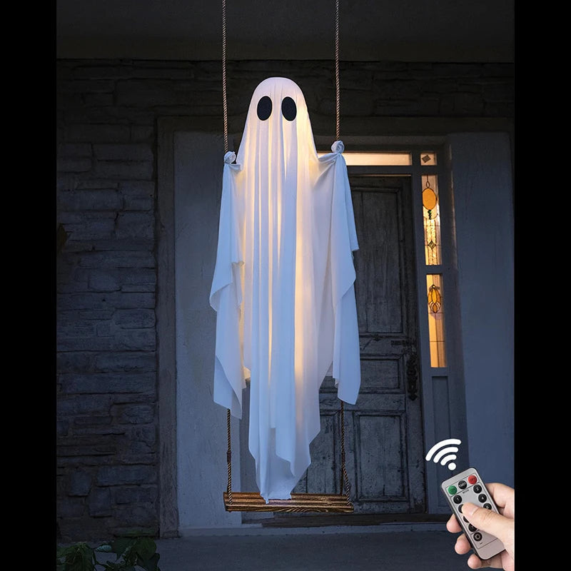 Light-up Halloween ghost decoration hanging on a swing