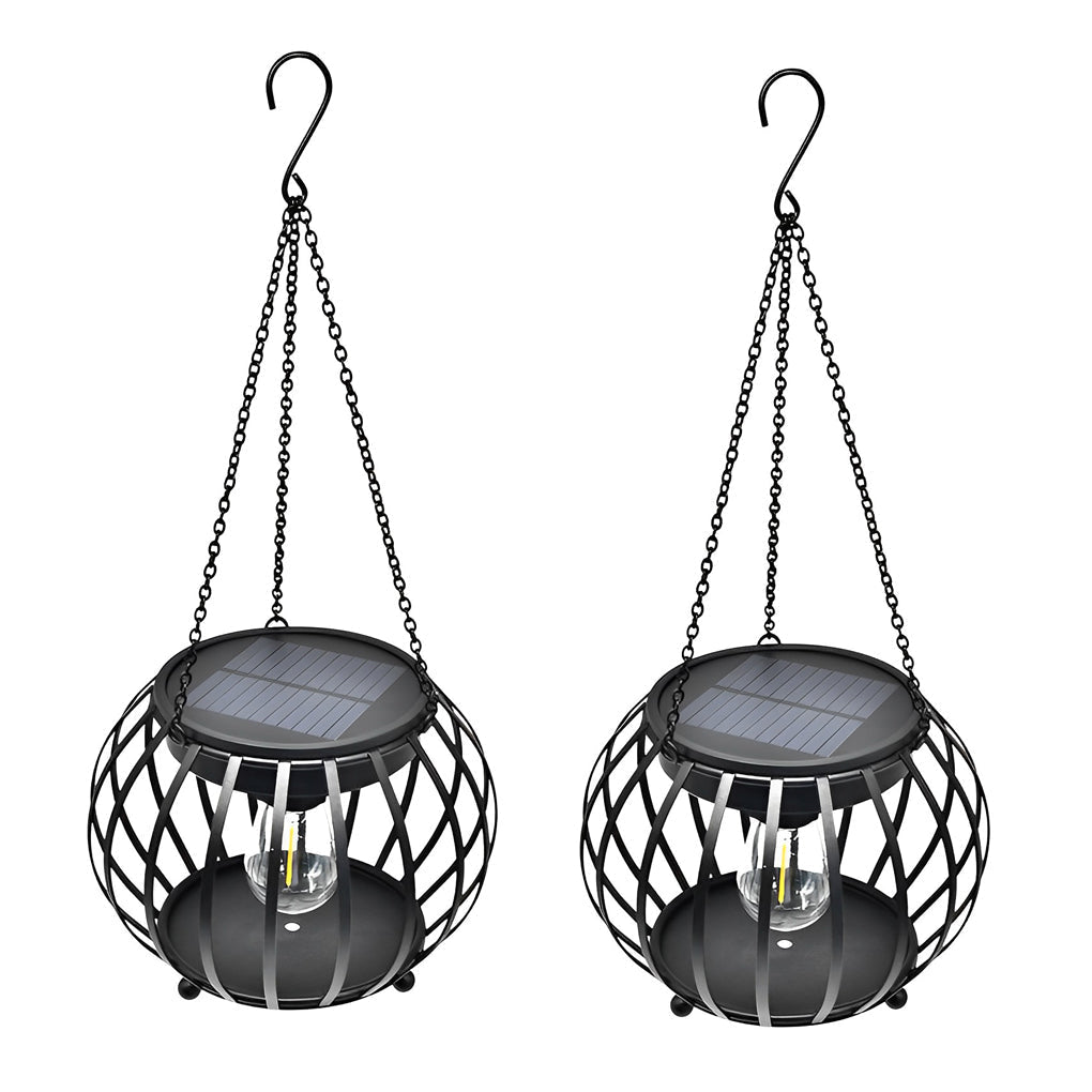 Two black pumpkin solar outdoor lanterns set on a porch