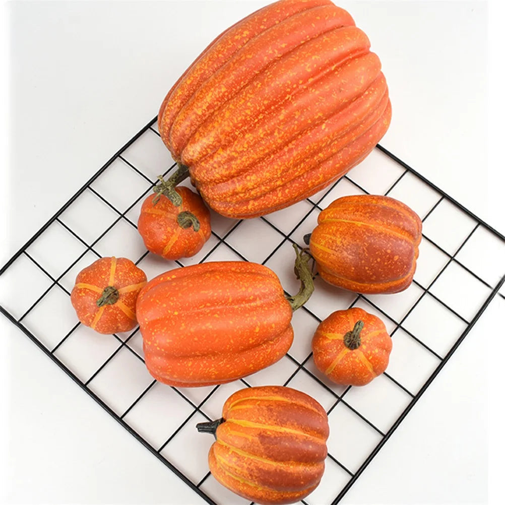Fake pumpkins with natural stems arranged as a fall centerpiece