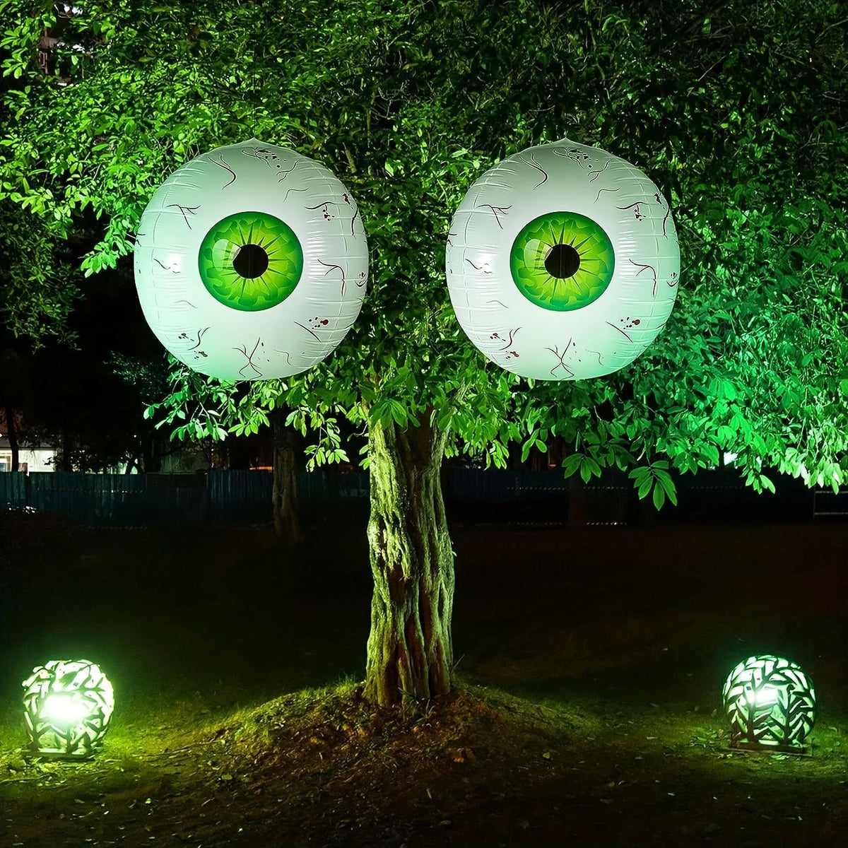 Creepy eyeball balloon hung as a Halloween party centerpiece