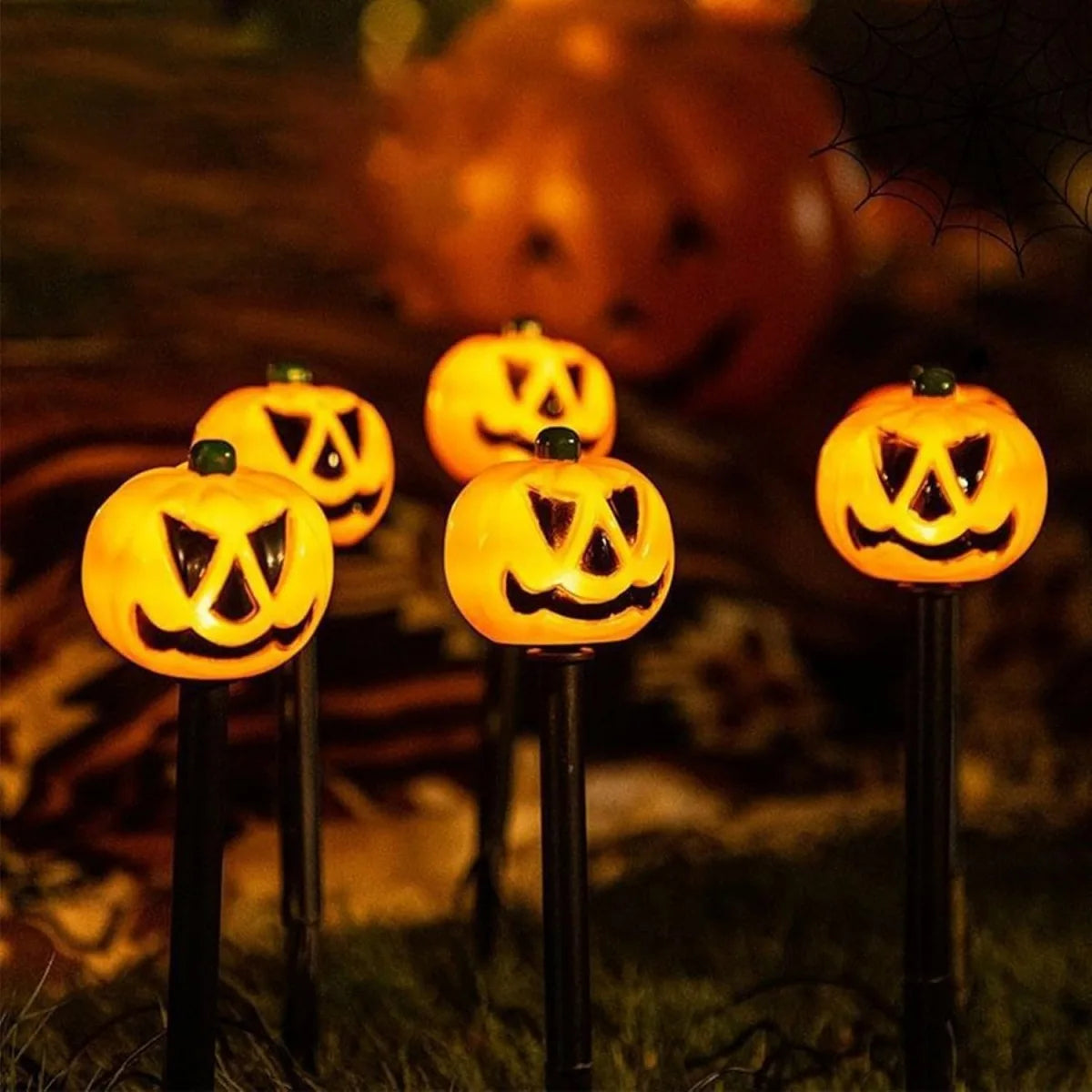 Small pumpkin solar Halloween yard light on a ground stake