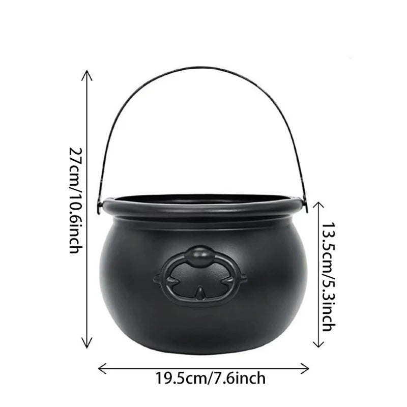 Plastic witch cauldron candy bowl shown on a party table