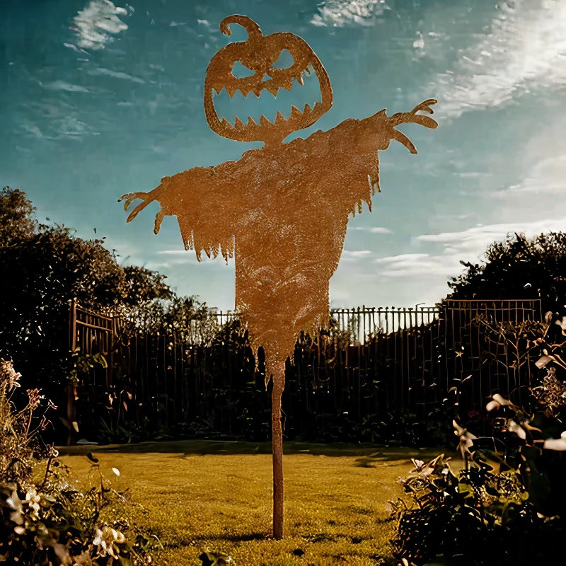 Close-up of the jagged-toothed pumpkin head on the metal scarecrow
