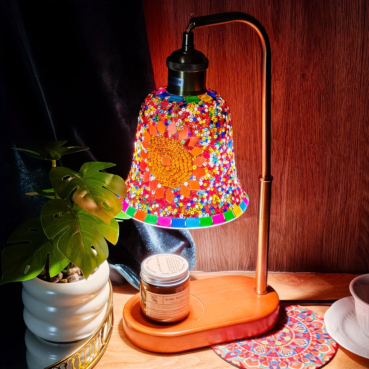 Handcrafted mosaic glass lamp glowing on a nightstand