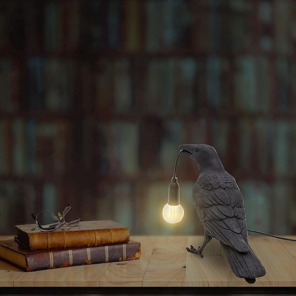 Close-up of the sculpted feather detail on the crow lamp