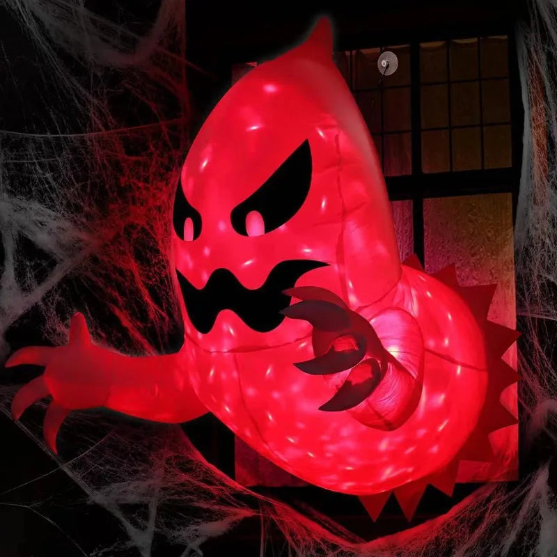 Inflatable ghost hung in a window with the included suction cups
