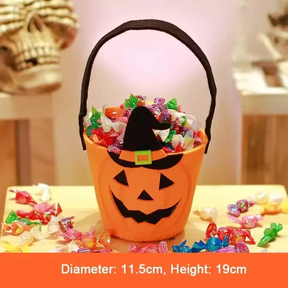 Child carrying a non-woven Halloween candy bucket by the handle