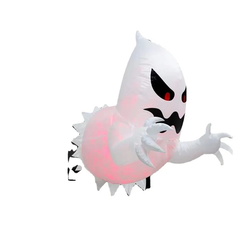 Inflatable Halloween ghost folded flat for storage next to its blower