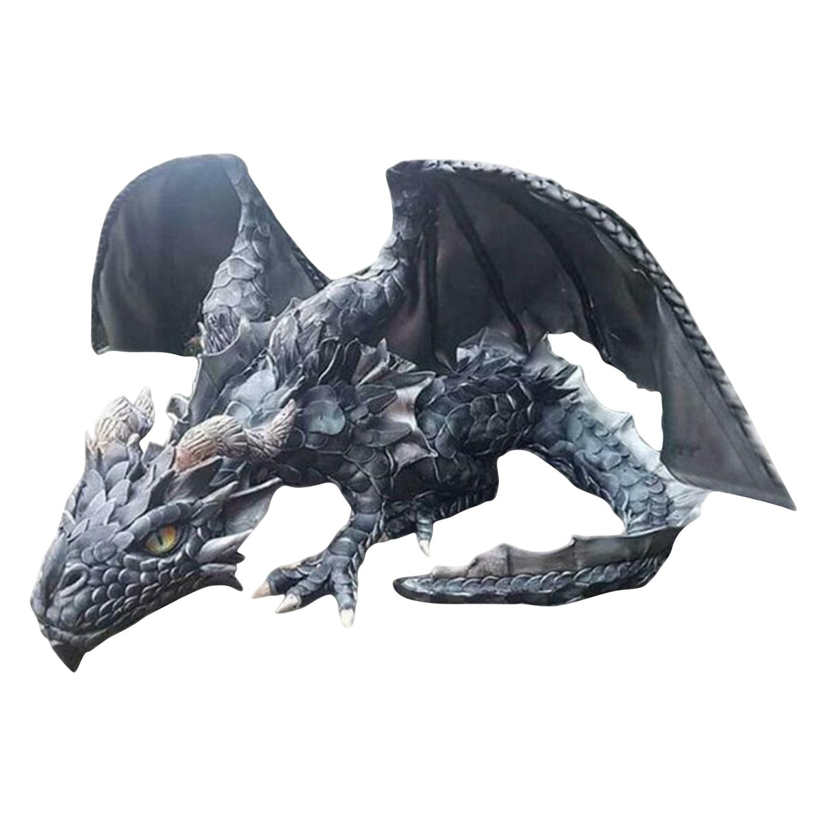 Dragon guardian figurine displayed outdoors beside plants