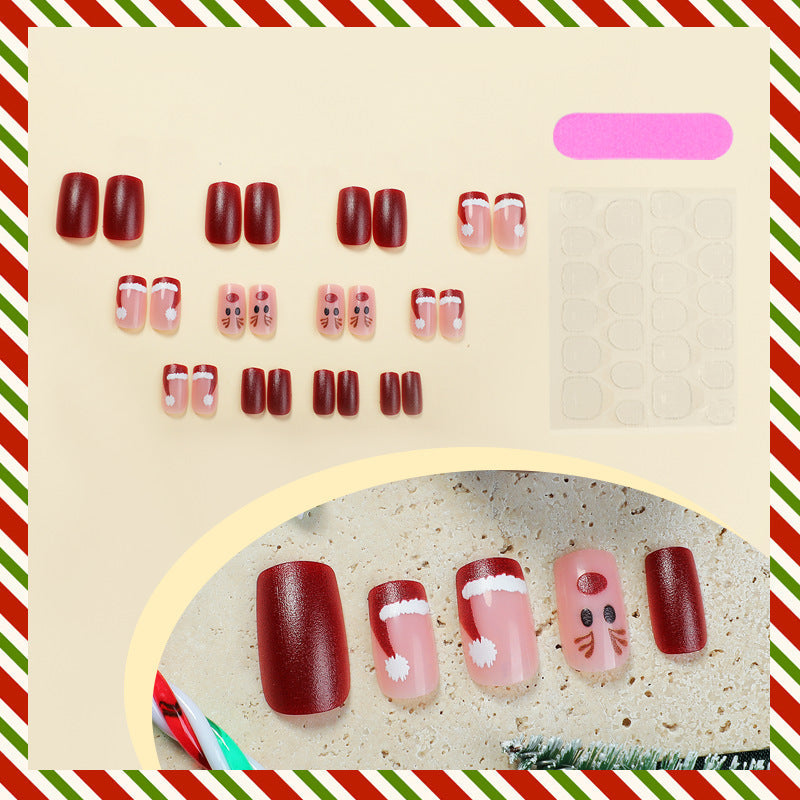Reindeer and Santa Christmas Nails in Red and Pink | Snowflake Press On Nail Designs | Festive Winter Manicure
