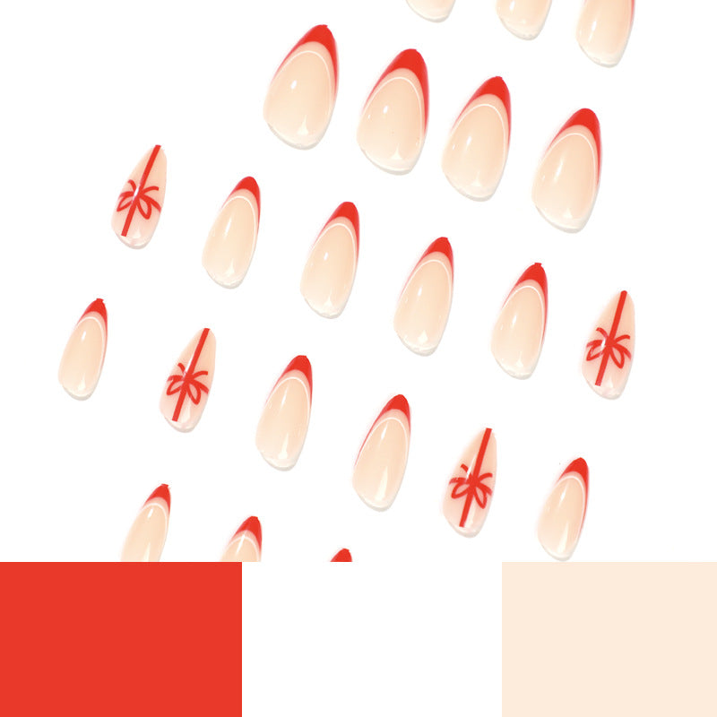 Stiletto Christmas Nails with Red Tips and Bow Motifs | Acrylic Press On Nail Set | Festive Manicure for Winter Parties
