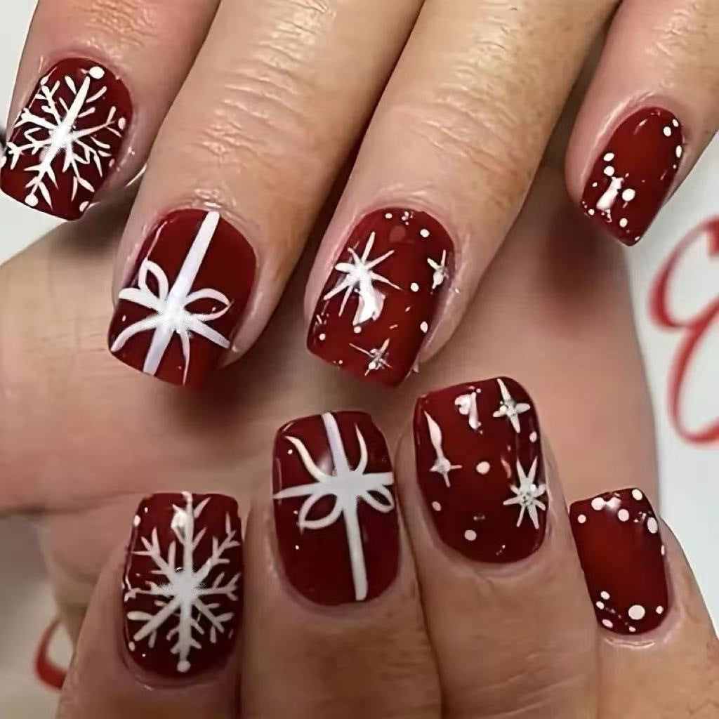 Christmas Press-On Nails in Deep Red with White Snowflakes | Festive Bow Motifs | Non-Toxic Build, Glossy Wear