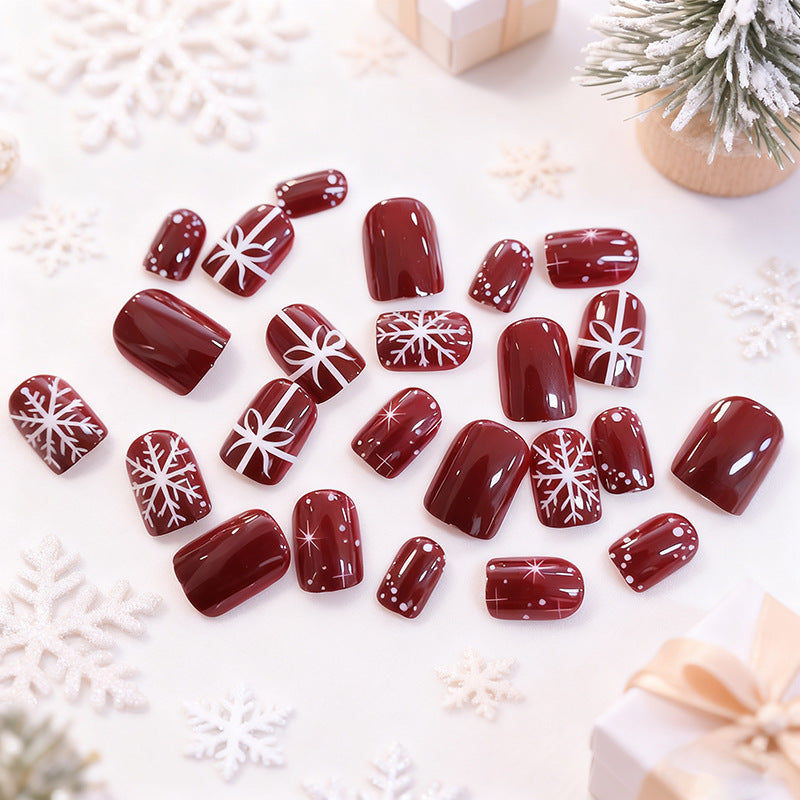 Christmas Press-On Nails in Deep Red with White Snowflakes | Festive Bow Motifs | Non-Toxic Build, Glossy Wear