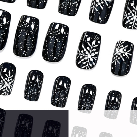 Black Christmas Nails with White Snowflake Art | Long Press-On Tips in a Glossy Finish | Elegant Pick for Winter Parties