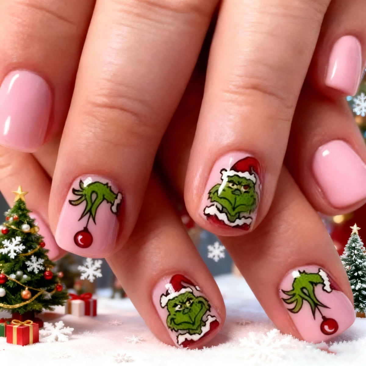 Christmas Press-On Nails with Green Cartoon Character Art | Santa Hat Accents in Pink and Red | Salon Finish at Home