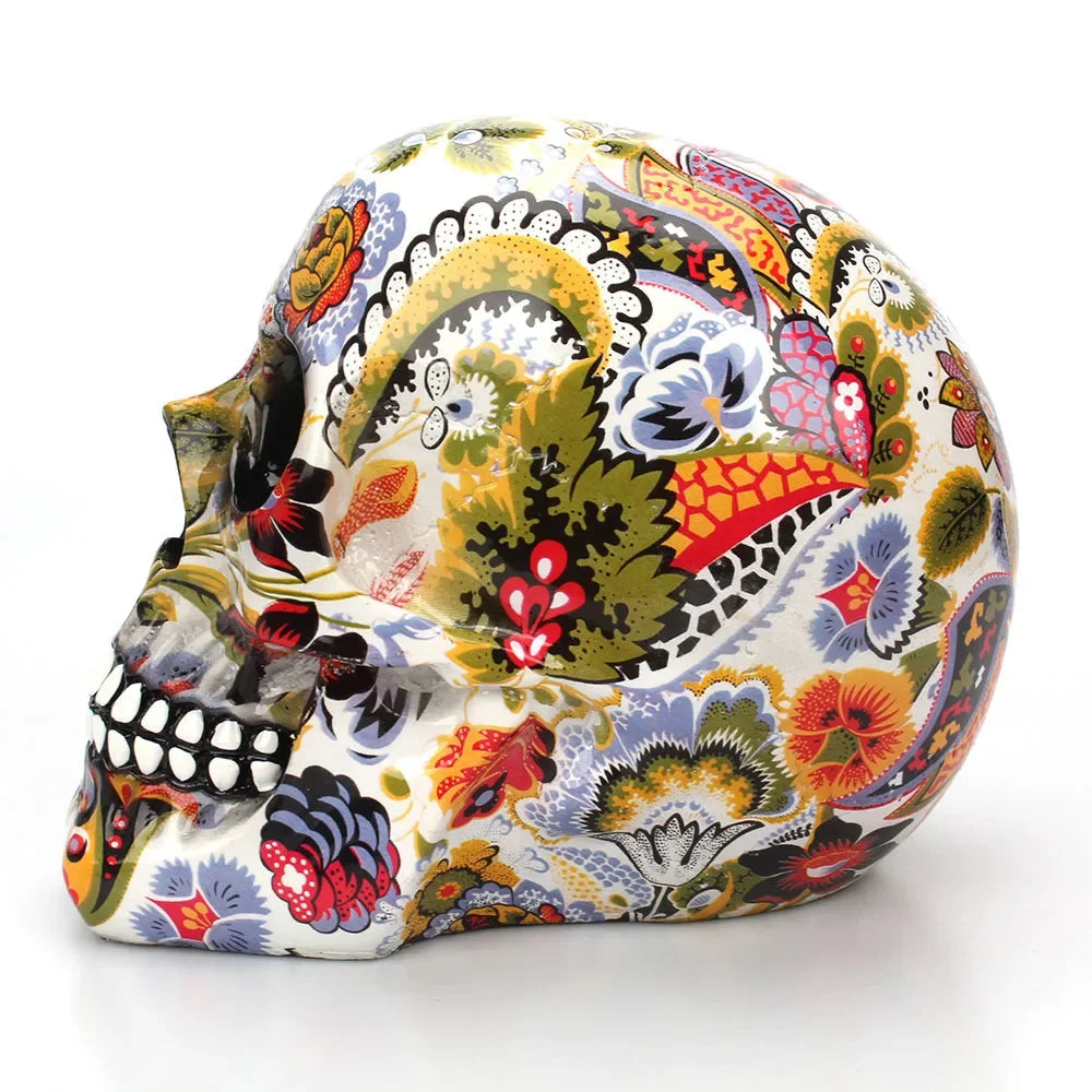 Close-up of hand-painted floral and vine detail on the decorative skull
