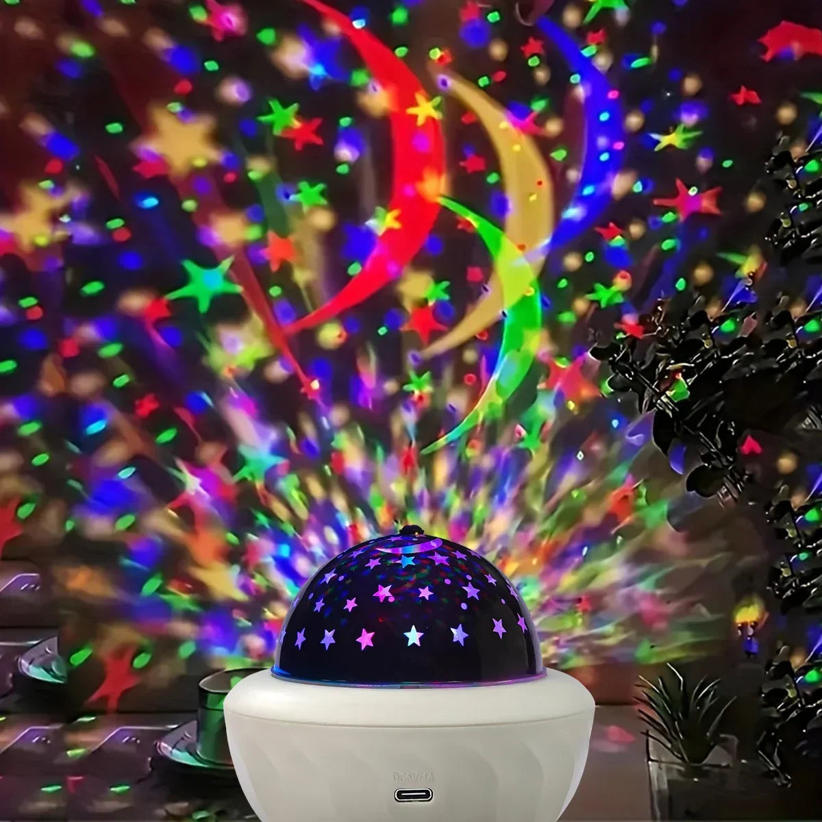 Star projector lamp lighting a bedroom ceiling with rotating stars